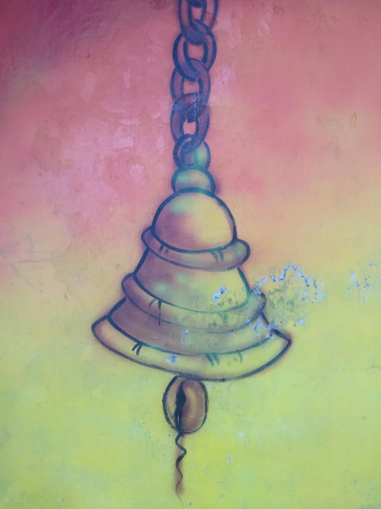 the bell on the wall has a drawing of a bell on it