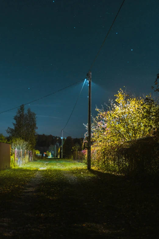 a stop sign in the night with the light on