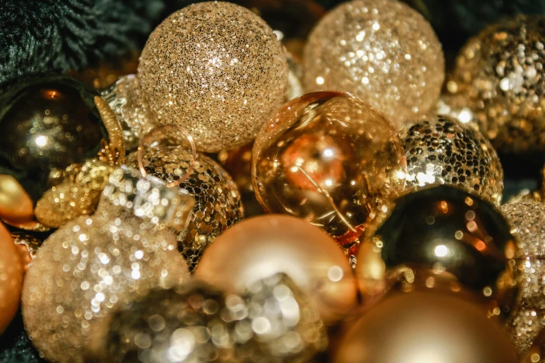 gold and black ornaments are arranged together