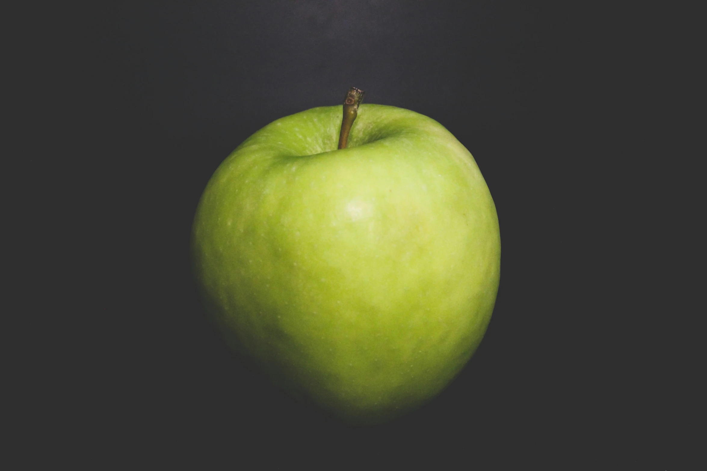 an image of a green apple in the middle