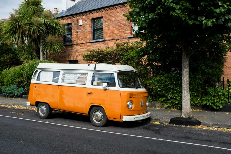 an old van that has been parked on the side of a road