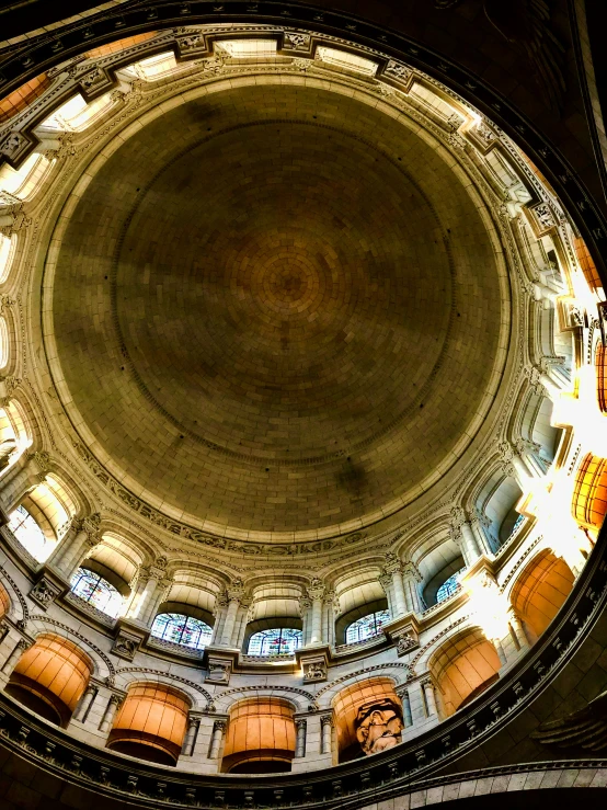 a circular building with several windows and ceilings