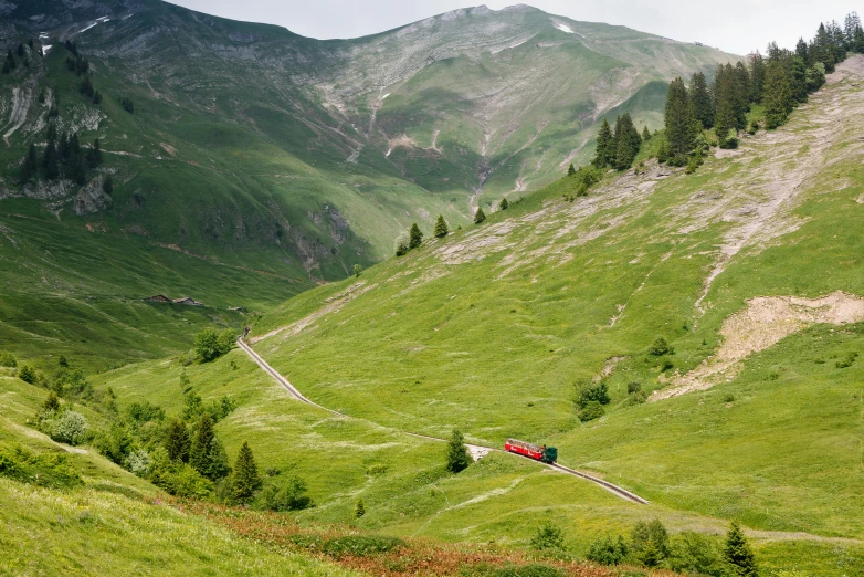 a train that is on the side of a mountain