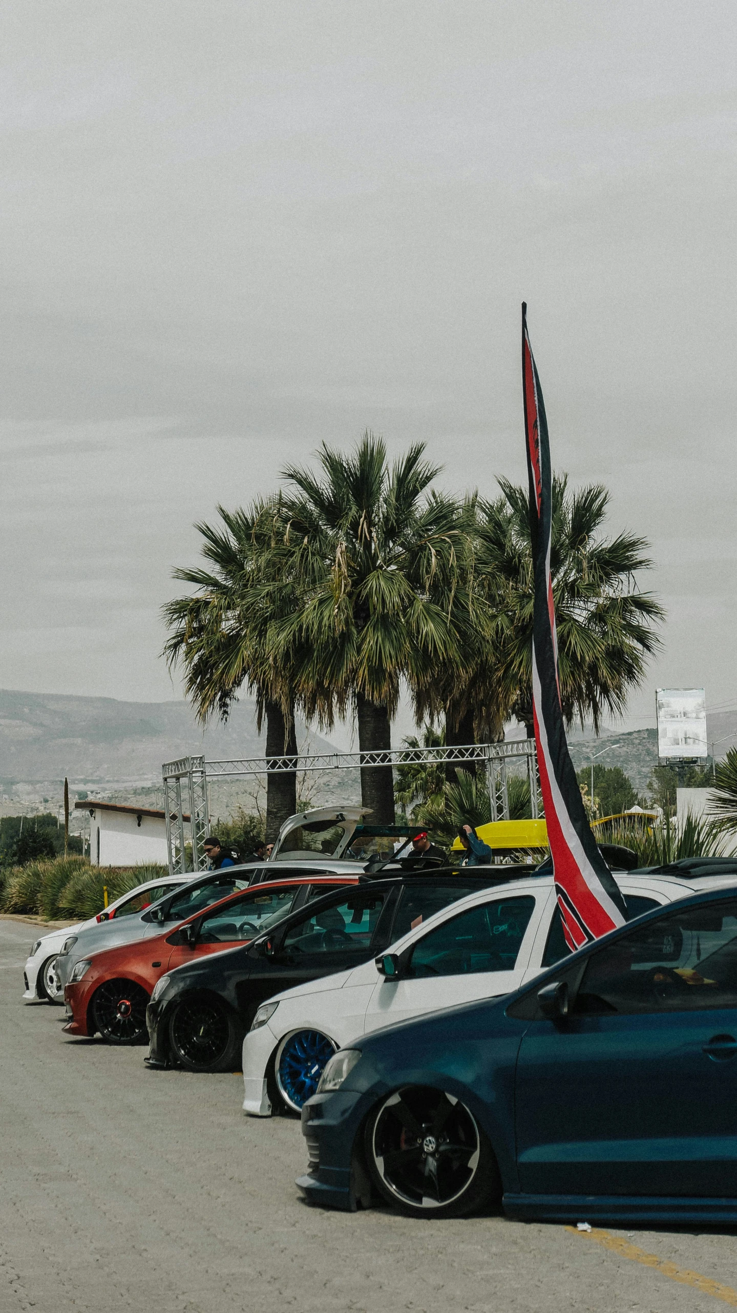 several car are parked on a parking lot