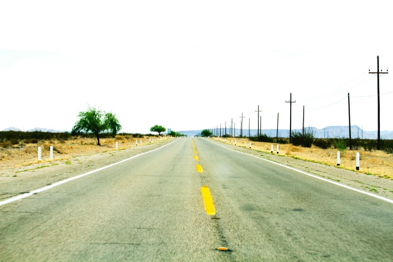 an empty road in the middle of nowhere