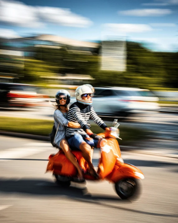 two people in helmets riding on a motorized scooter