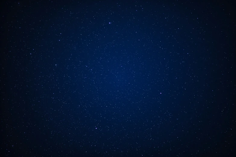 a dark blue space with stars