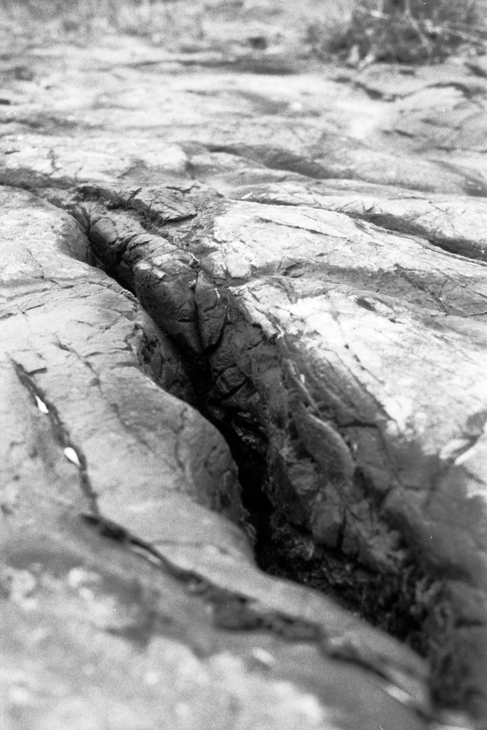 an old rock is shown in black and white