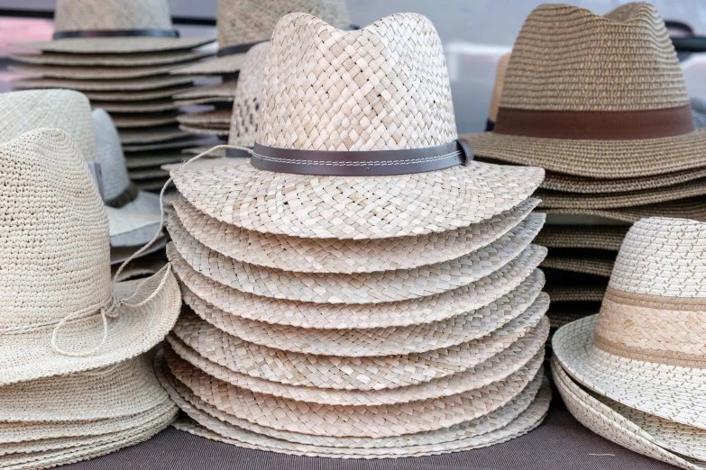 a bunch of hats stacked up next to each other