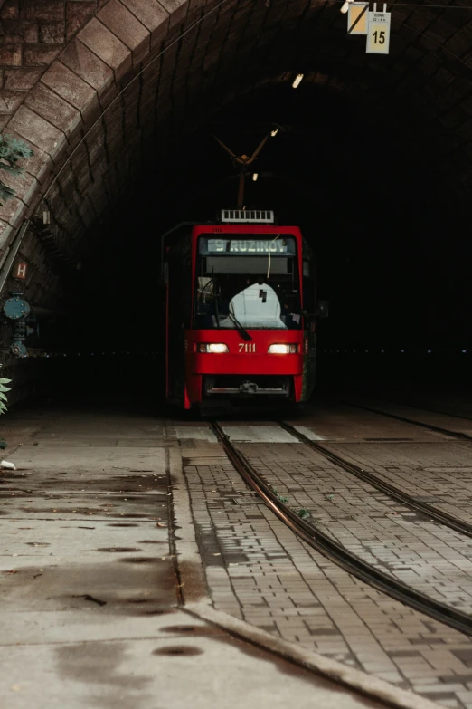 the bus is coming out of a tunnel