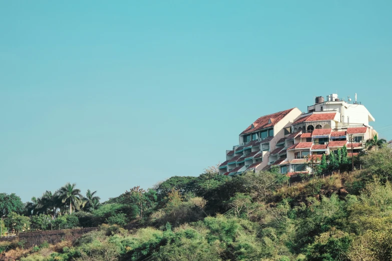 the view of a building with a large balcony on top