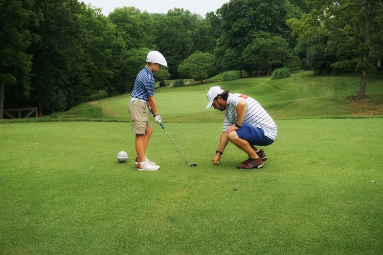 a group of people on a field playing golf