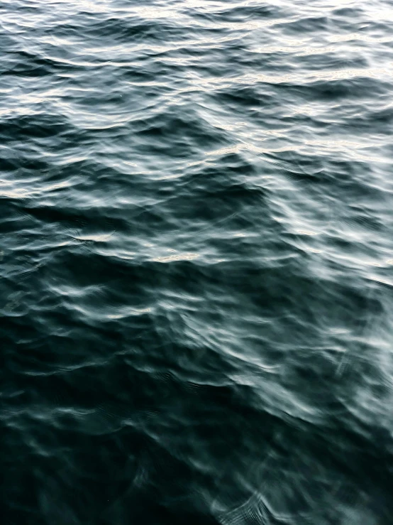 a large body of water with waves coming in to shore