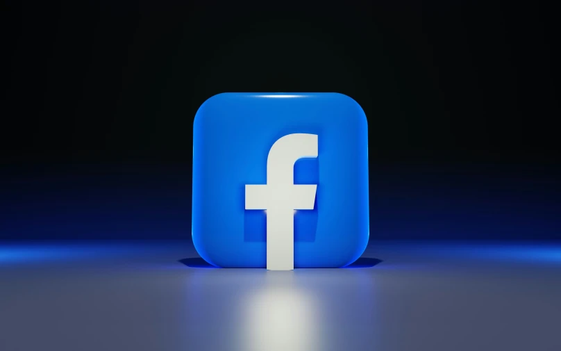 facebook logo in front of a black background