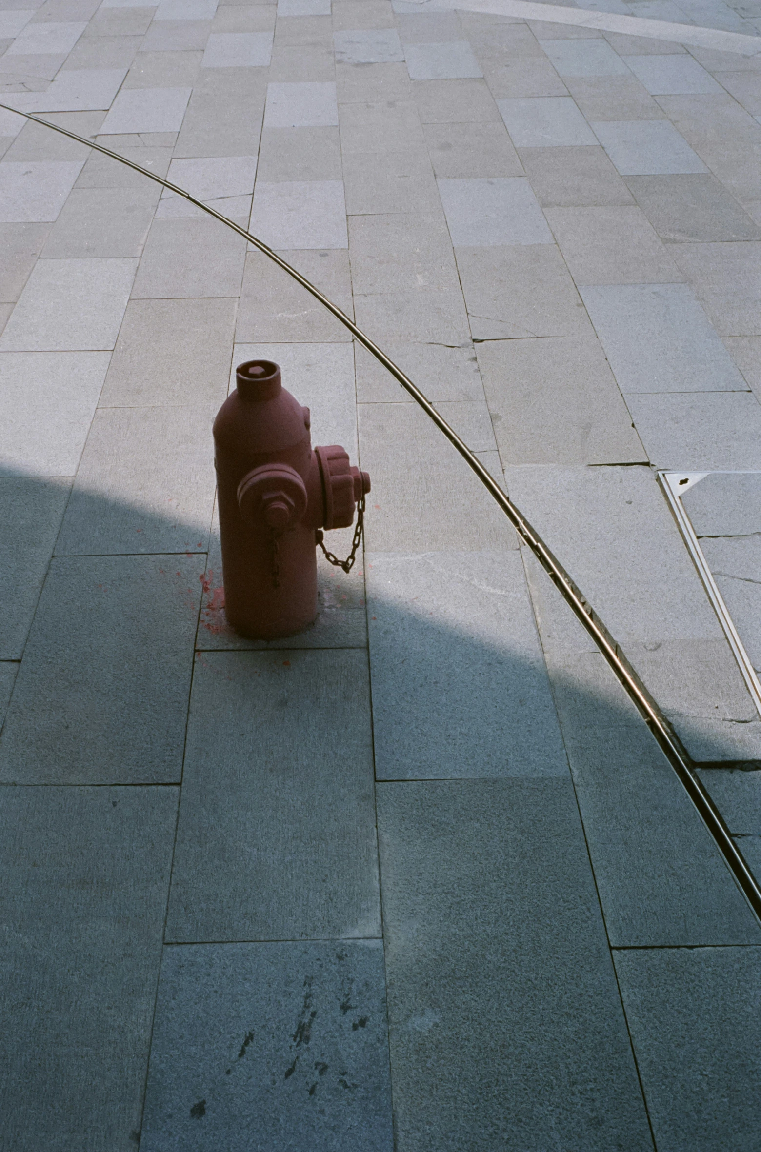 an iron object and a red fire hydrant