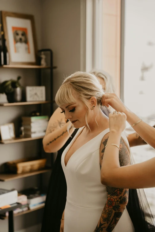 bride getting hair done before her wedding ceremony