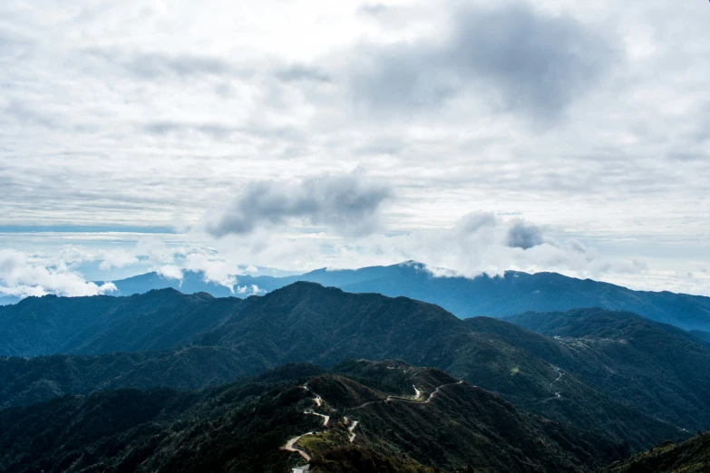 a scenic image of many mountain hills in the day