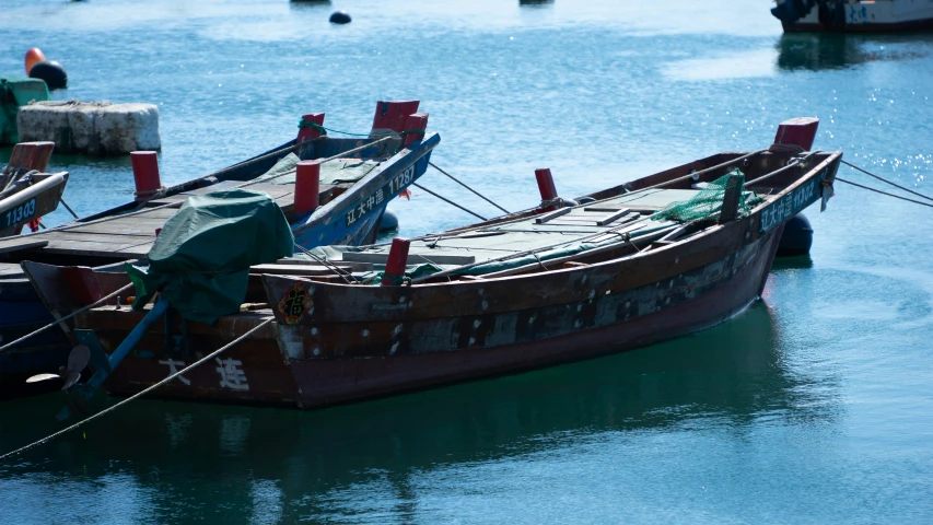 some small boats docked on the water