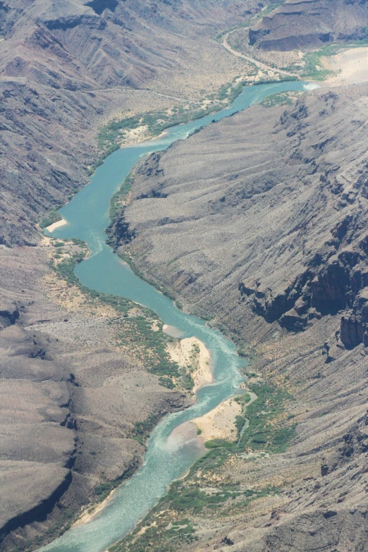 aerial view of a river flowing through a canyon