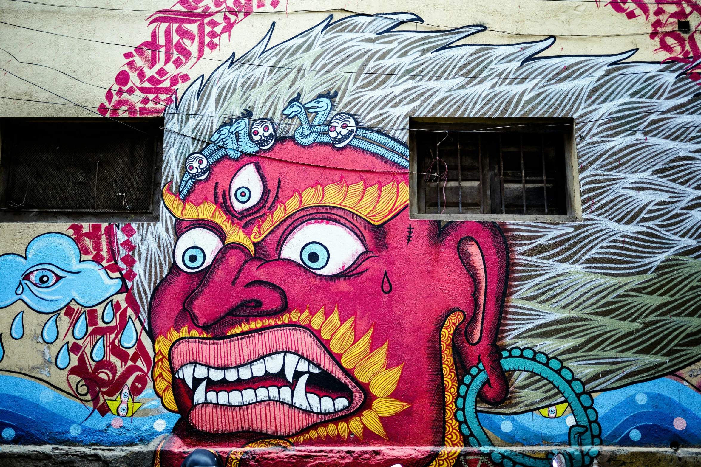 graffiti depicting a demon on the side of a building