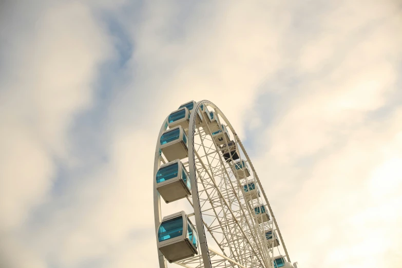 a ferris wheel at an amut park with some blue windows