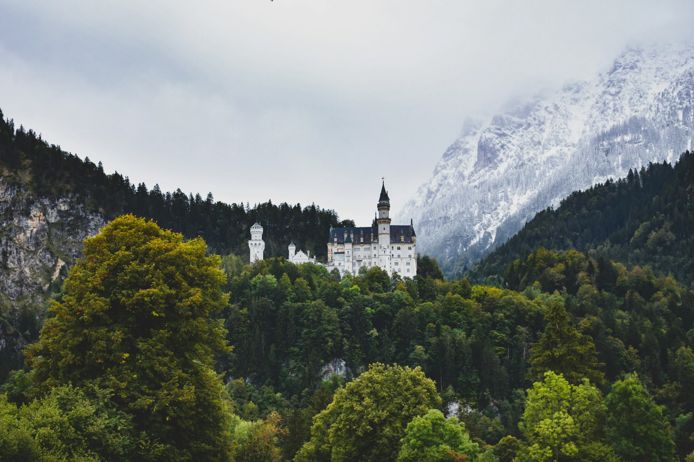 a castle with a large steeple in the background