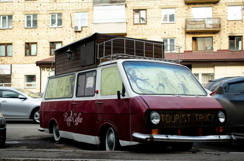 an old fashioned van with a roof over it