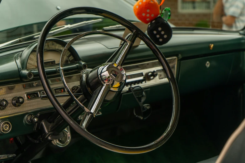 a close up of a steering wheel and dashboard