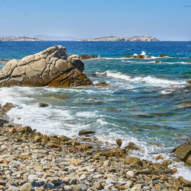 a rocky beach surrounded by a body of water