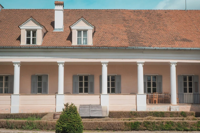 an old building with two columns, and pillars