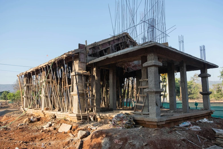 a small structure made out of wood is surrounded by rubble