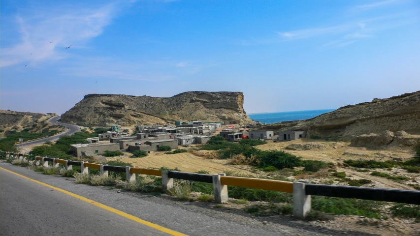 the view of a small town from the road on the side