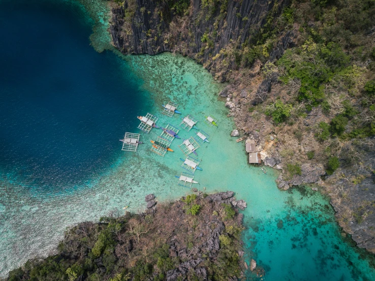 a view of an island with some boats sitting at the bottom