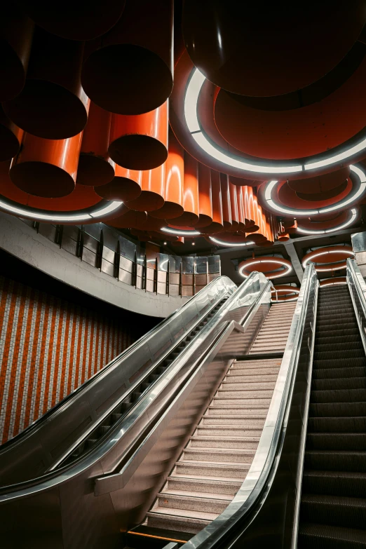 an escalator that is very long and has some lighting above it