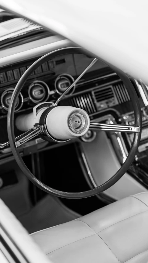 a po of the steering wheel and dash s in a car