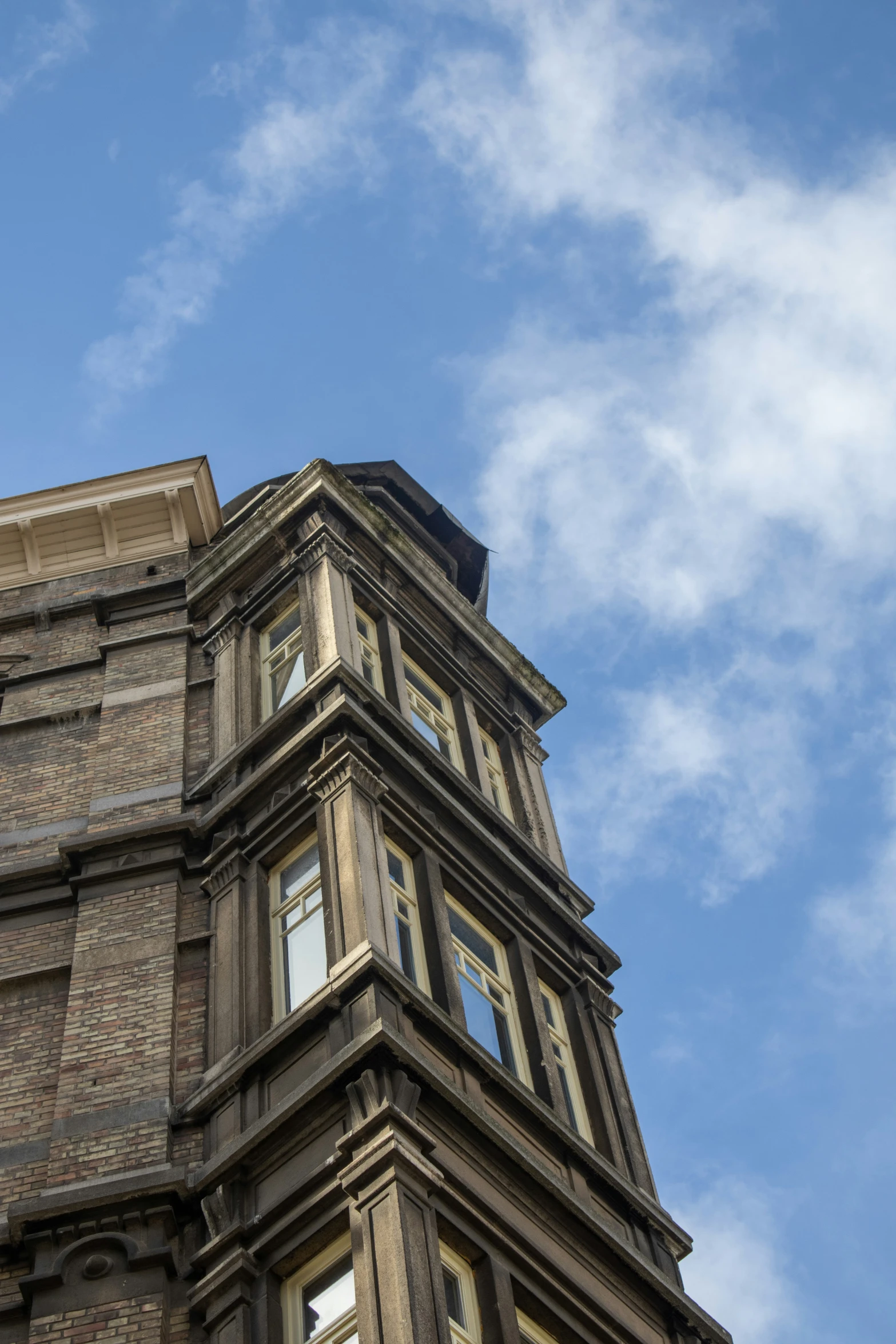 looking up at a large clock on the side of a building