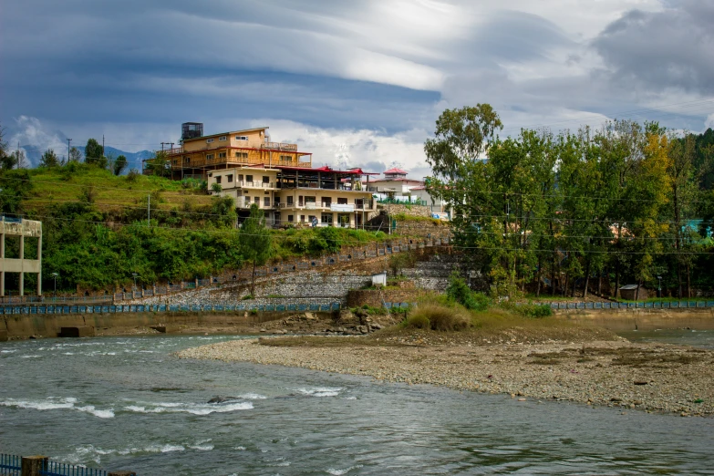 a house on a hill near a lake