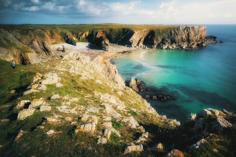 a couple of small cliffs overlooks a body of water