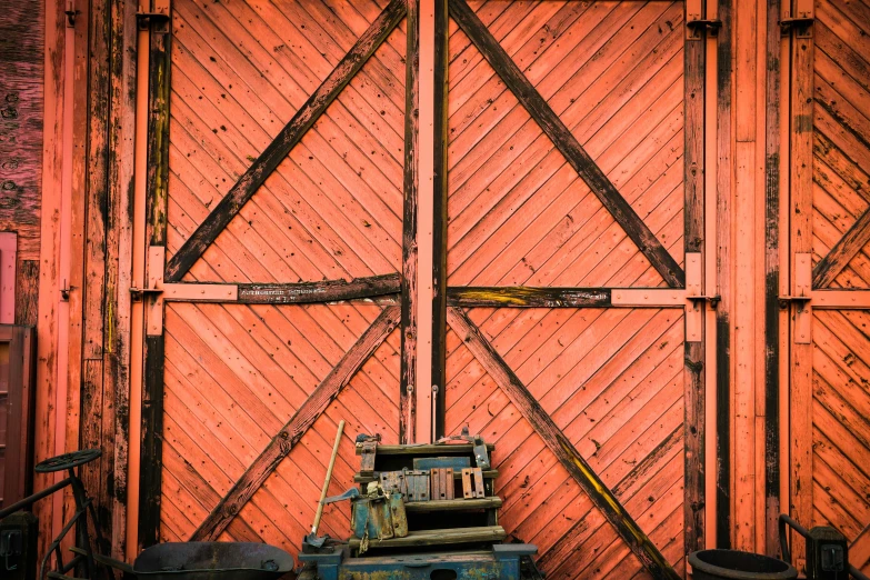 an orange fence with a blue box sitting in the middle