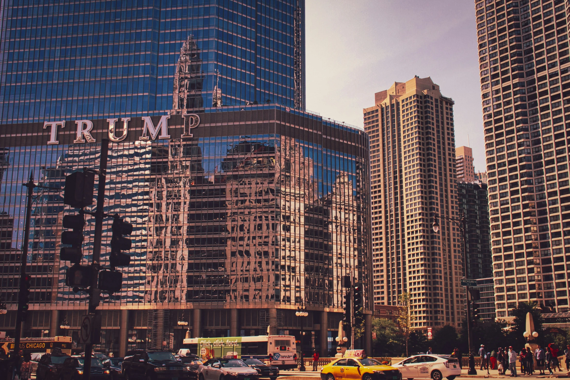 the intersection in front of large buildings and traffic signals