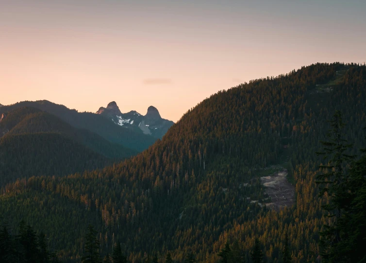 some mountains with a sky view at sunset