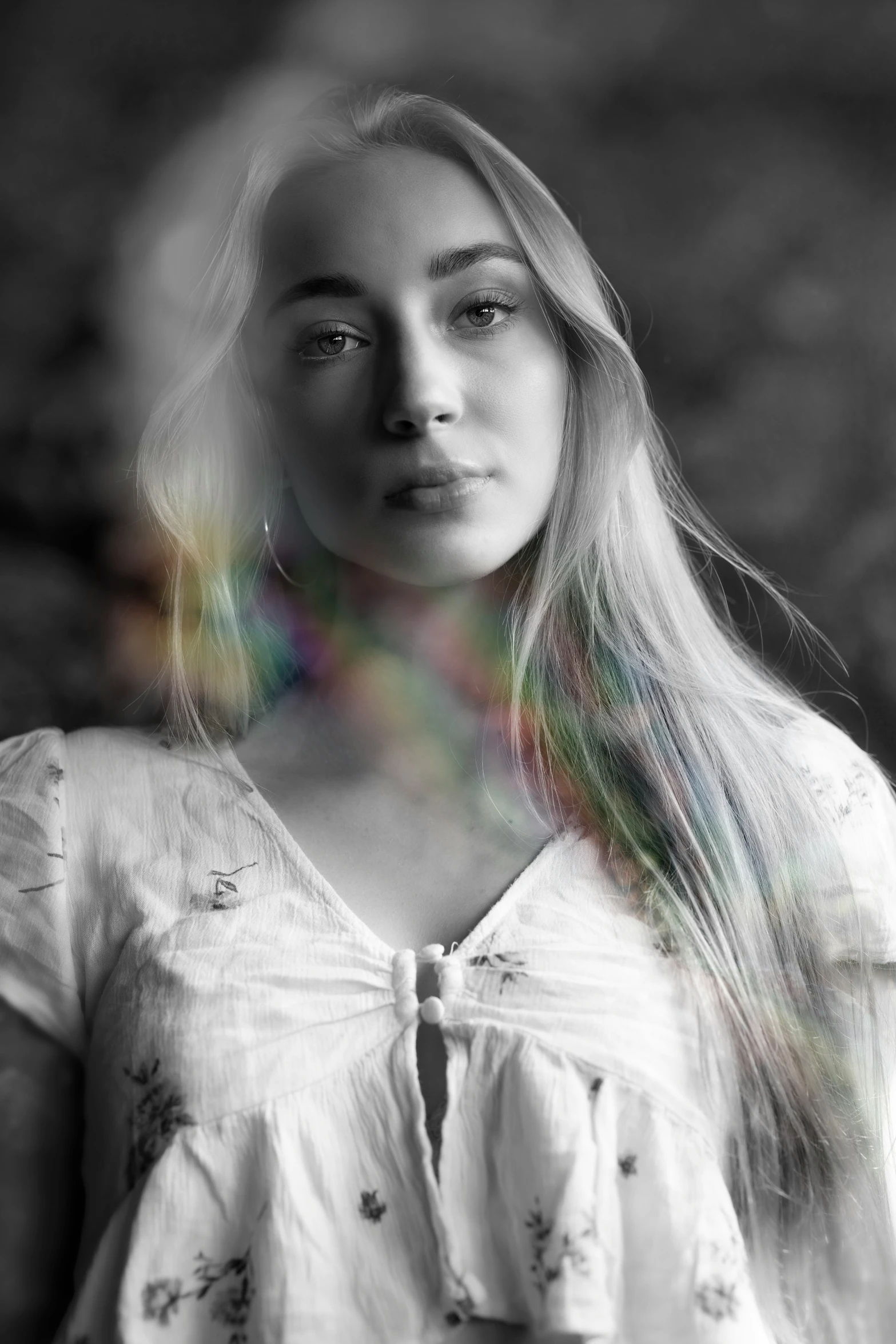 a black and white image of a woman in a white shirt