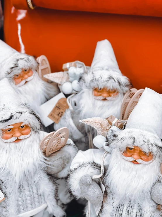 white toy stuff on display in front of an orange object