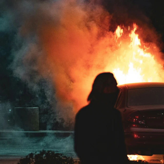 a car is set on fire during a night time