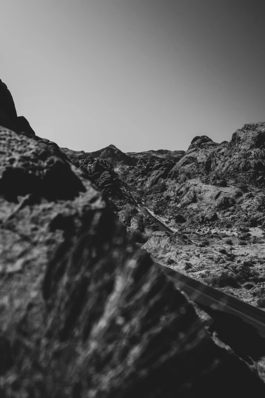 a long road with rocks on it passing by