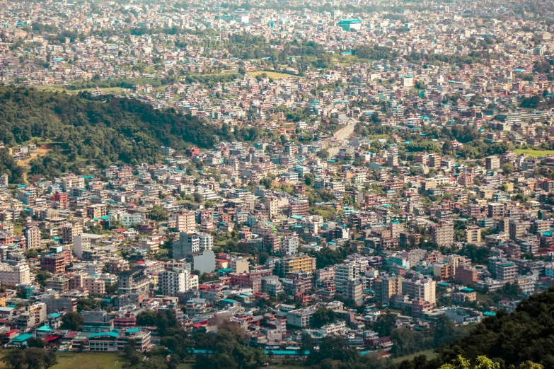 aerial view of large and crowded city in the mountains