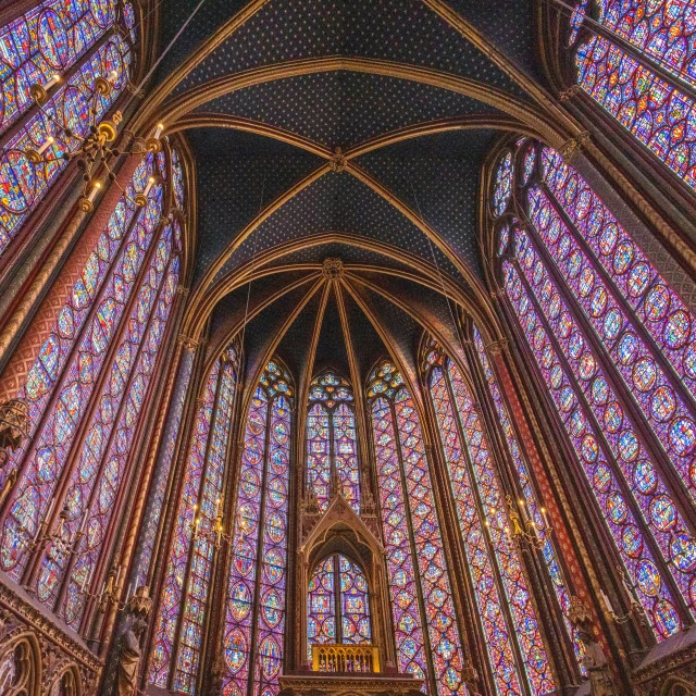 the interior of a building with a large colorful stained glass window