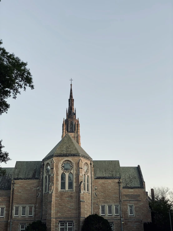 this building has an steeple that is visible in the distance