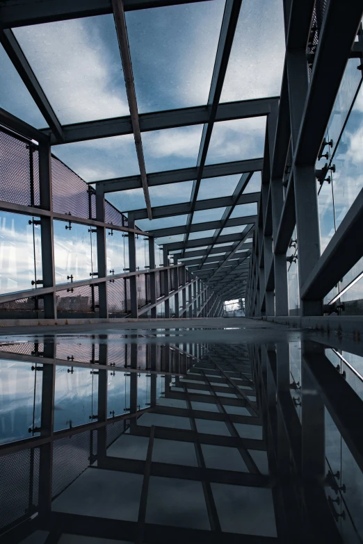 the floor is reflecting the blue sky in the water