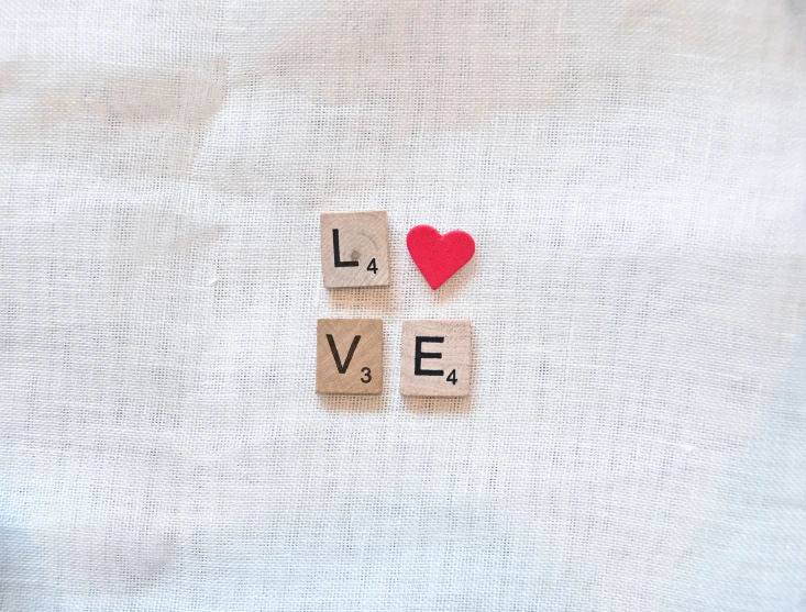 a po taken looking up at the words love and spelled with wooden blocks